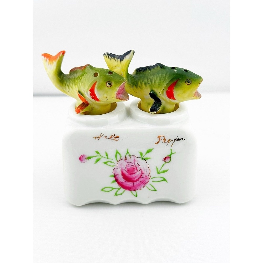 Vintage Japanese porcelain nodder fish salt & pepper shakers with a floral base
